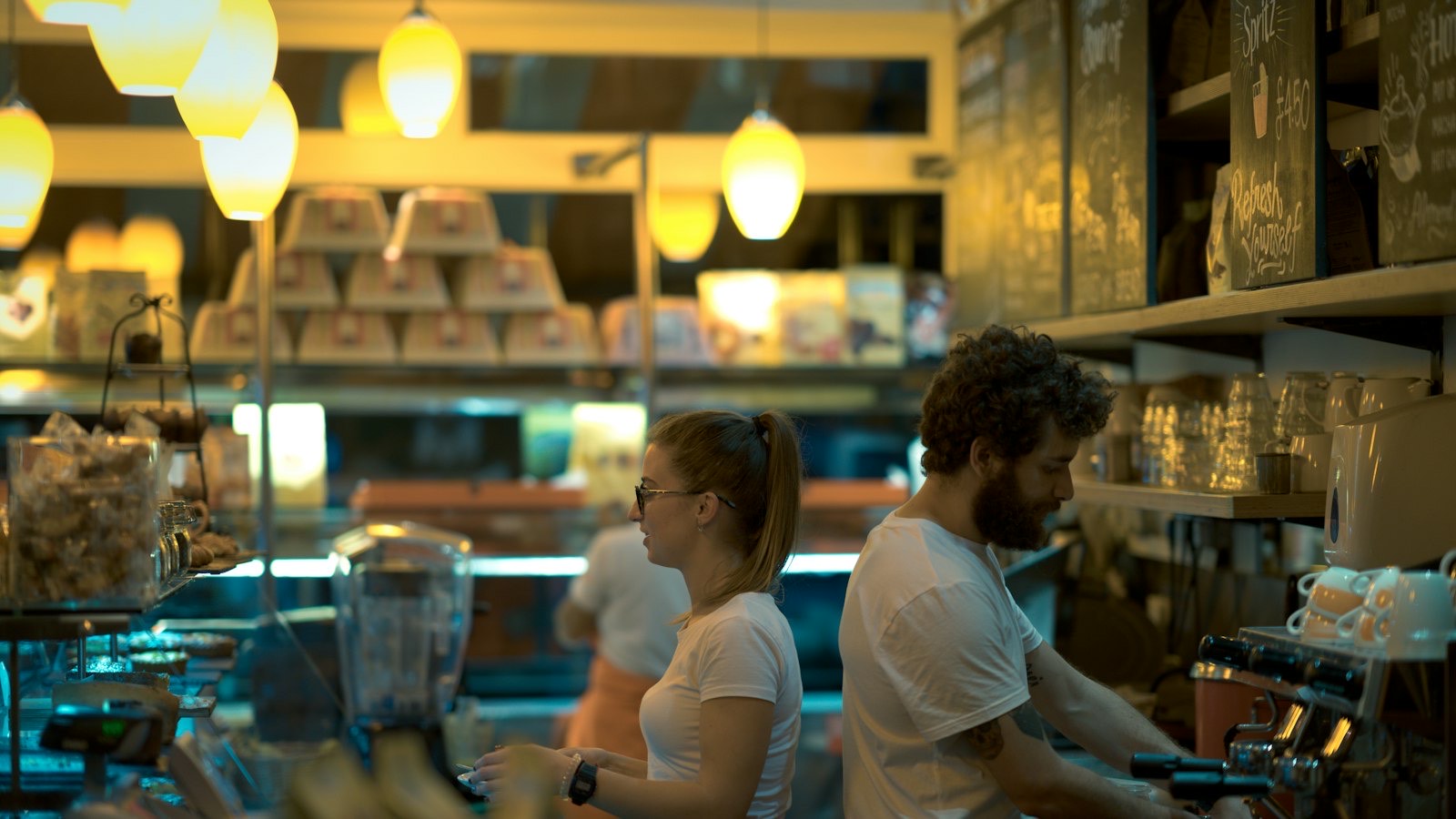 Staff serving customers in a busy British cafe